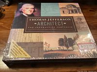 Front of sealed slipcased portfolio showing title and artwork