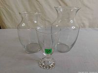 Front view of all three clear glass vases