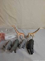 Six assorted plastic animal figurines displayed