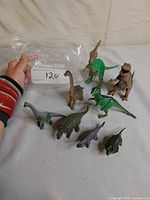 Group shot of all eight dinosaur figures