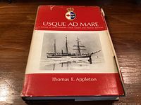 Front of hardcover book with dust jacket showing title, author and image