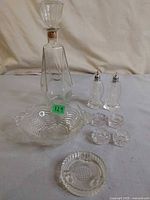 Group shot of all nine clear pressed glass pieces