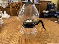 Full coffee maker assembled showing upper and lower glass globes