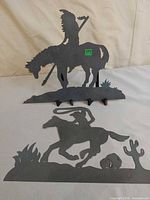 Both metal silhouettes together for scale and overview