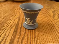 Overall view of blue jasperware trumpet vase front side