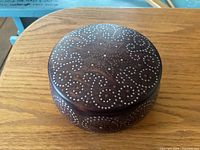Closed wooden spice box showing inlaid dot pattern on lid and sides