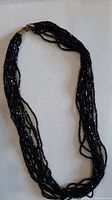 Full view showing length, multiple strands and clasp