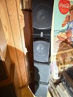 Front view showing stacked black speakers with grilles