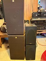 Stacked view of two Celestion and two Mirage speakers