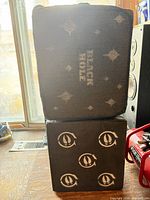 Front view of two stacked foam archery blocks showing graphics and size