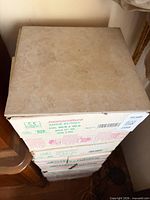 Stack of sealed tile boxes