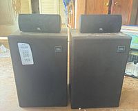 front view showing two large bookshelf speakers with two small speakers on top