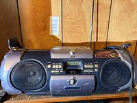 Front view showing entire JVC RV-B55 boombox, speakers, controls, strap