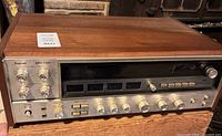 Front and top view showing entire Sansui QRX-7500 receiver with wood cabinet