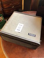 Closed beige textured carry case showing Sony Tapecorder badge