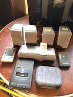 Group shot showing Sony Walkman, Citizen mini TV, GE cassette recorder, RCA speakers, fabric case