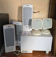 Altec Lansing subwoofer with four tall satellites, two cube satellites and control pod