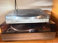 Technics SL-3 stacked above Dual 1249, lids closed
