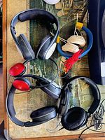 Group of five headphones on table