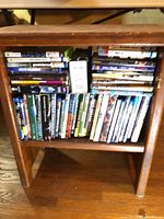 Entire shelf with Xbox 360 games, DVDs and VHS tapes