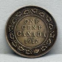 Reverse side showing denomination, country and date inside maple leaf wreath