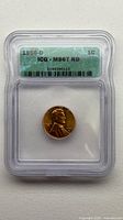 Obverse view of 1956-D Lincoln Wheat Cent within ICG slab showing grade MS67 RD label