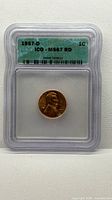 Front view of ICG slab showing 1957-D Lincoln Wheat Cent and grade label