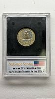 Reverse of 1965 Washington quarter inside NGS slab, NuGrade Service branding visible