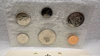 Front view of six 1969 Canadian coins sealed in original plastic film