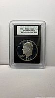 Encapsulated 1972-S Eisenhower dollar in INB slab front view