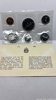 Full sealed 6-coin set with information card visible