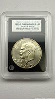 Front of INB-slabbed 1973-S Eisenhower Dollar showing certification label and obverse