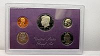 Full view of sealed proof set showing all five coins in case