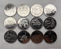 Front view of all 12 1999 Millennium quarters
