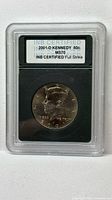 Obverse side of 2001-D Kennedy half dollar in INB slab with certification label visible