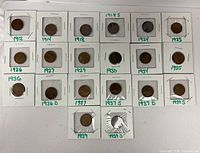 All 16 coins in flips laid out in three rows