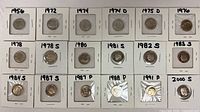 Row view of all 18 dimes in flips showing years and mint marks