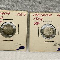 Both coins in holders showing dates and obverse portraits