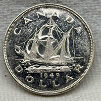 Reverse of 1949 Canada silver dollar showing ship design