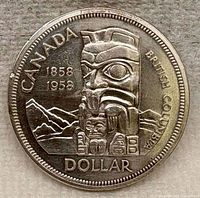 Reverse of 1958 Canadian Silver Dollar showing totem pole design and inscriptions