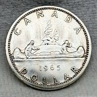 Reverse of 1965 Canadian Voyageur dollar