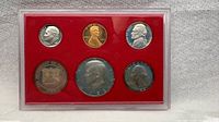Front view of entire six-piece 1982 proof set in red holder