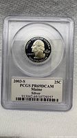 Obverse of 2003-S silver Maine quarter in PCGS slab showing label with grade PR69DCAM
