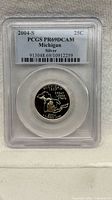 PCGS slab front displaying label with 2004-S PR69DCAM Michigan Silver 25C and coin reverse