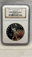 Obverse view of encapsulated 2006-P Benjamin Franklin Scientist silver dollar showing NGC label and grade