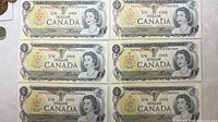 Front view of six consecutive 1973 $1 banknotes