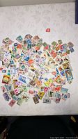 Full spread of assorted stamps on table