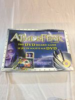 Box lid showing Atmosfear branding and DVD icon