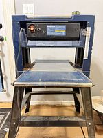 Front view of Mastercraft thickness planer on stand