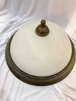 Overall view of dome light showing glass shade and metal trim